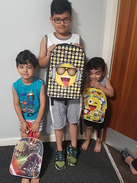 SMILE children with donated backpacks